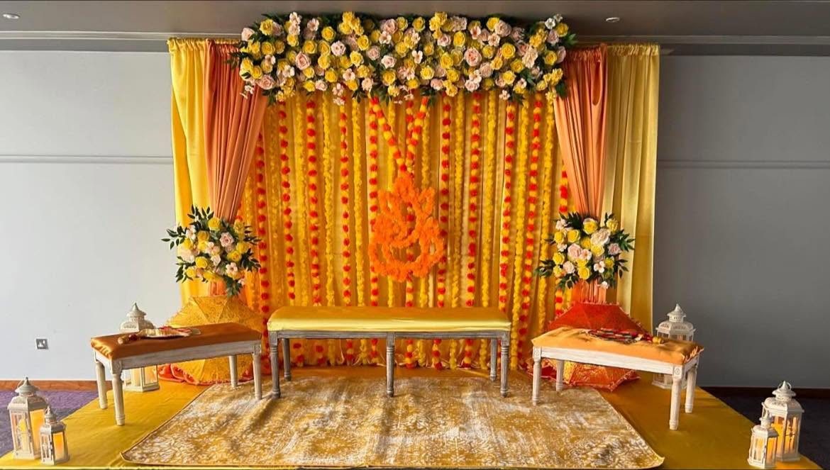 Marigold Haldi ceremony backdrop styled for an Indian pre-wedding event