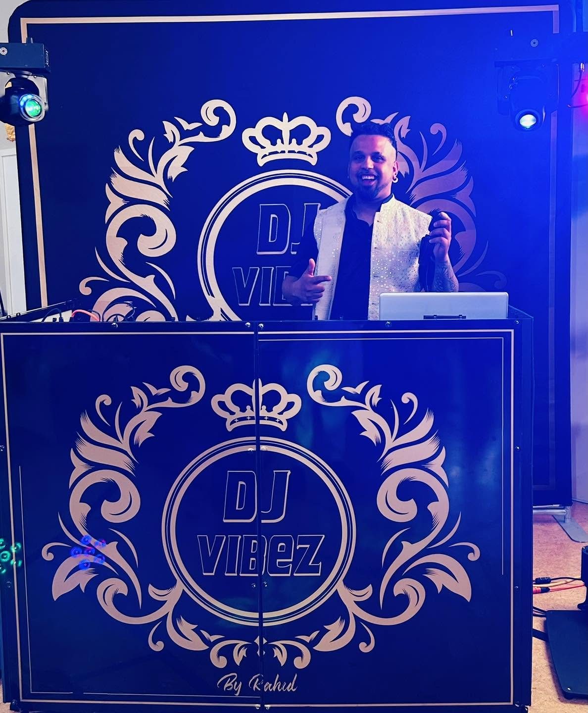 Premium DJ booth with stage lighting at a wedding reception